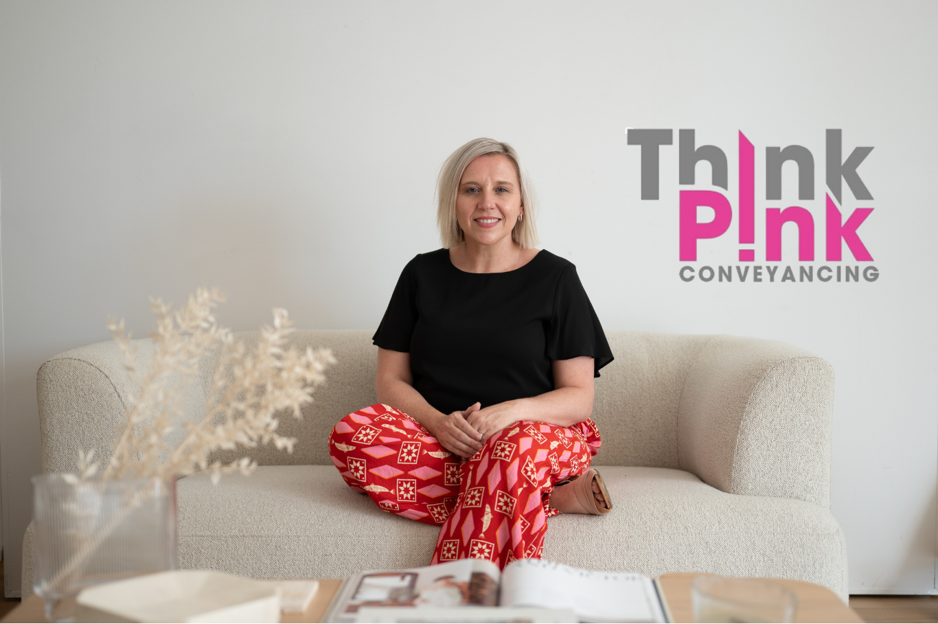 Think Pink Conveyancing team member seated in the Think Pink Conveyancing office